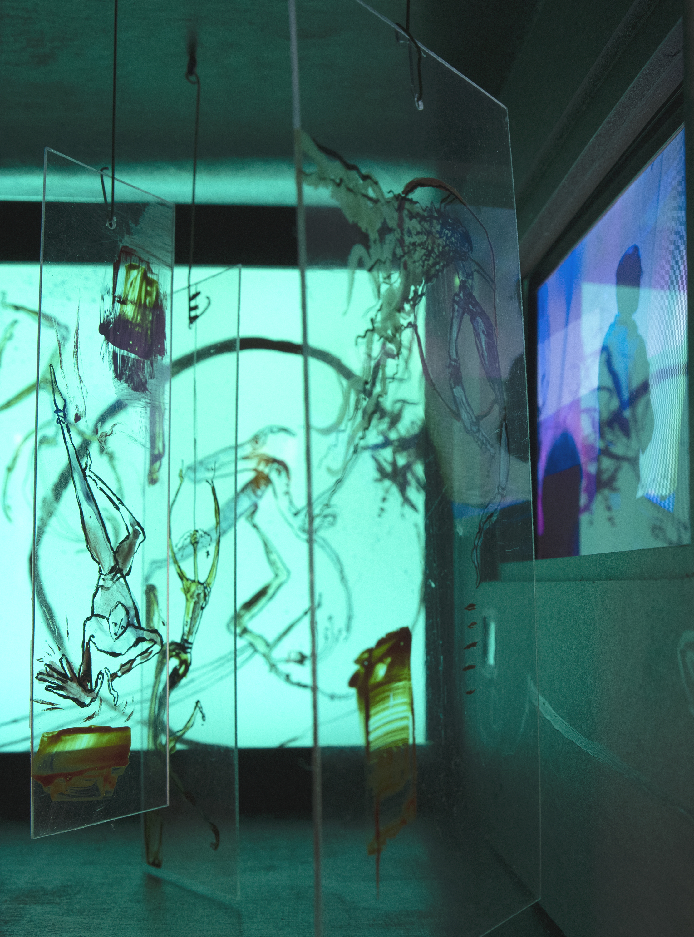 looking inside from right side opening – in front of clear painted acrylic panels with video on the right